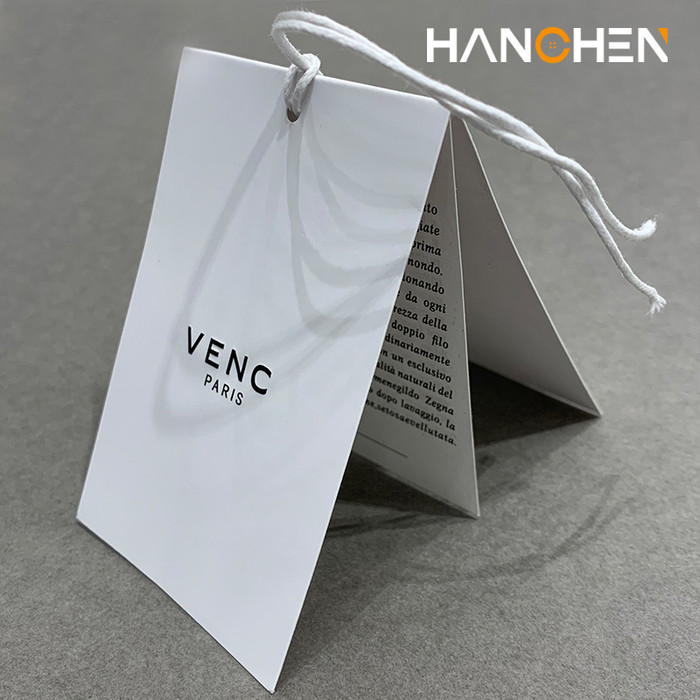 汉宸辅料吊牌定做高端服装辅料订制激凸UV工艺商标 logo免费设计特种纸吊牌定制加厚吊牌图1