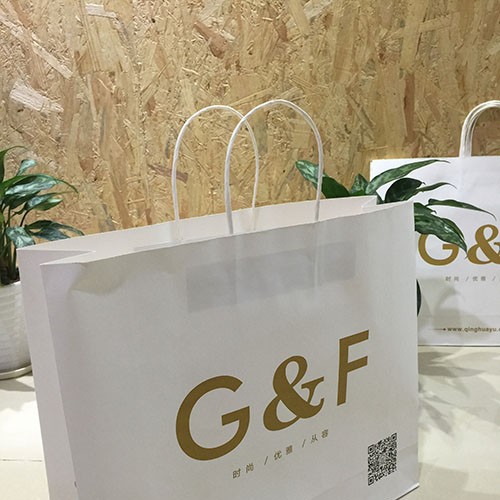 【合纳包装】厂家订制白色牛皮纸手提袋 各类纸质服装、礼品广告袋 免费设计logo图2